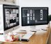 two imac s with keyboard and phones on desk